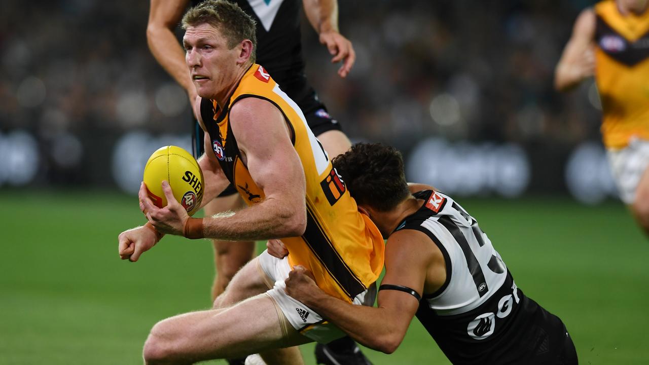 ADELAIDE, AUSTRALIA - MARCH 26: Ben McEvoy of the Hawks tackled by Karl Amon of Port Adelaide during the round two AFL match between the Port Adelaide Power and the Hawthorn Hawks at Adelaide Oval on March 26, 2022 in Adelaide, Australia. (Photo by Mark Brake/Getty Images)