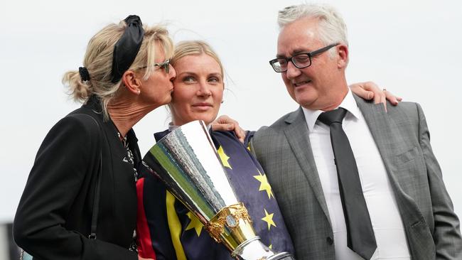 Jamie Kah with her parents Karen and John after Goldrush Guru won the Victoria Derby. Picture: George Sal/Racing Photos via Getty Images