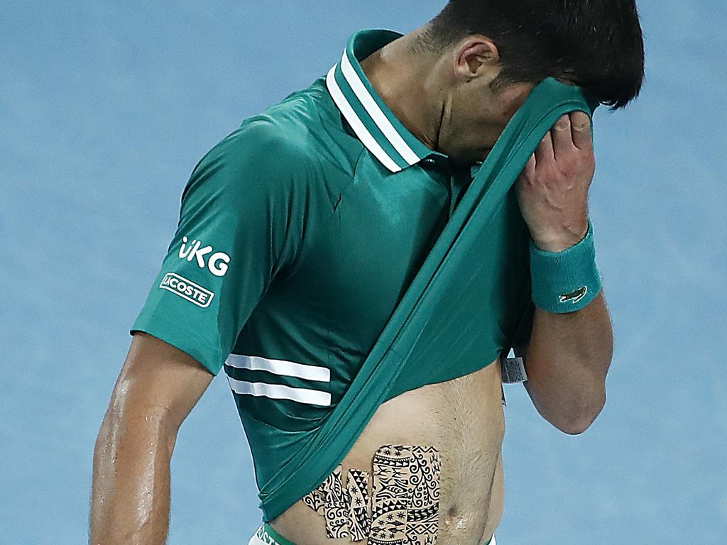 Djokovic’s mid-section was all taped up after injuring his abs.