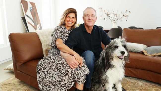 Fuller at home with his wife Andrea and Barney the rescue dog. Picture: Rohan Kelly