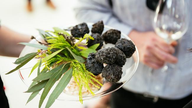 Campfire “coals” filled with barramundi and smeared with a Vegemite mayo