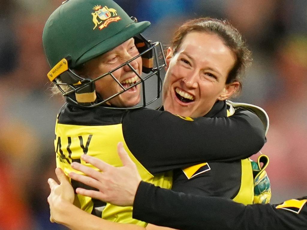Megan Schutt of Australia celebrates with  Alyssa Healy after dismissing Shafali Verma of India during the Women's T20 World Cup final match between Australia and India at the MCG in Melbourne, Sunday, March 8, 2020. (AAP Image/Scott Barbour) NO ARCHIVING, EDITORIAL USE ONLY, IMAGES TO BE USED FOR NEWS REPORTING PURPOSES ONLY, NO COMMERCIAL USE WHATSOEVER, NO USE IN BOOKS WITHOUT PRIOR WRITTEN CONSENT FROM AAP