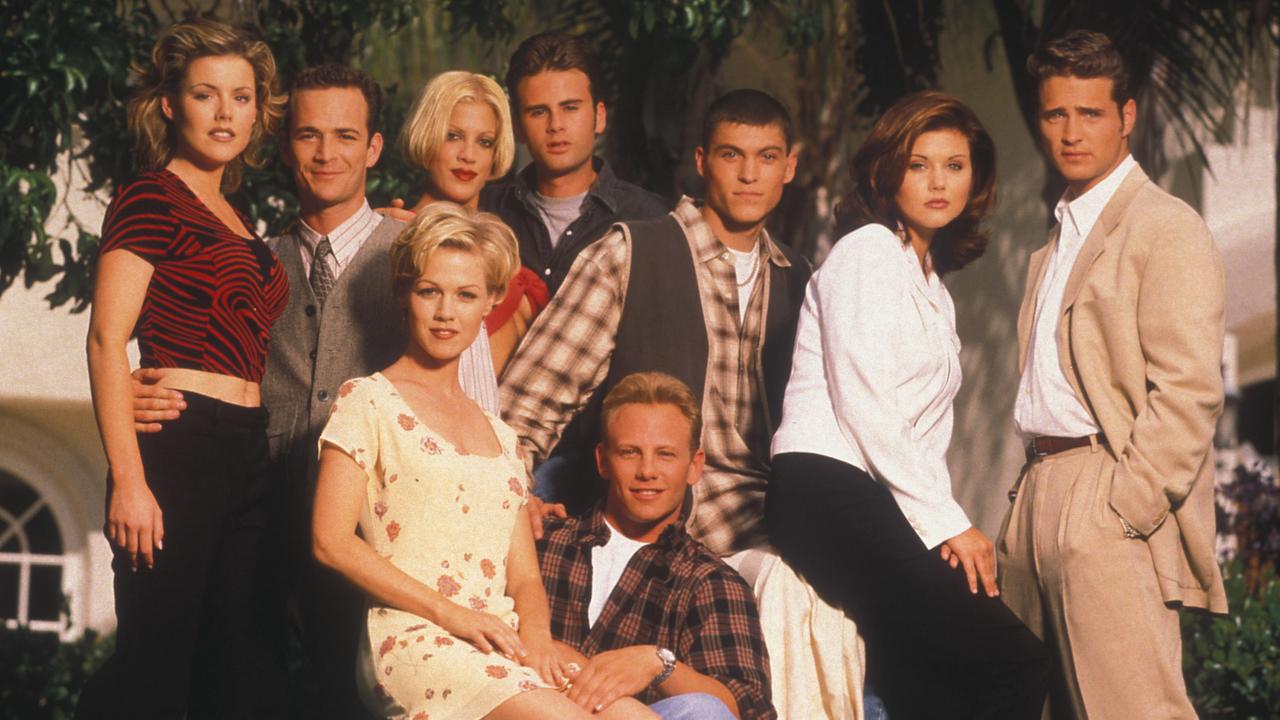 Tiffani, in the white long sleeved shirt, with the case of Beverly Hills, 90210. Picture: Alamy