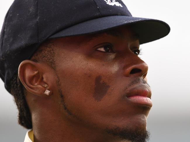 England's Jofra Archer looks on on the first day of the fourth Ashes cricket Test match between England and Australia at Old Trafford in Manchester, north-west England on September 4, 2019. (Photo by Paul ELLIS / AFP) / RESTRICTED TO EDITORIAL USE. NO ASSOCIATION WITH DIRECT COMPETITOR OF SPONSOR, PARTNER, OR SUPPLIER OF THE ECB