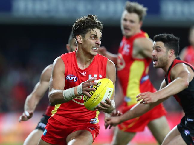 Sean Lemmens of the Suns runs the ball during the round 17 AFL match between the Gold Coast Suns and the Essendon Bombers at Metricon Stadium on July 14, 2018 in Gold Coast, Australia. (Photo by Chris Hyde/Getty Images)