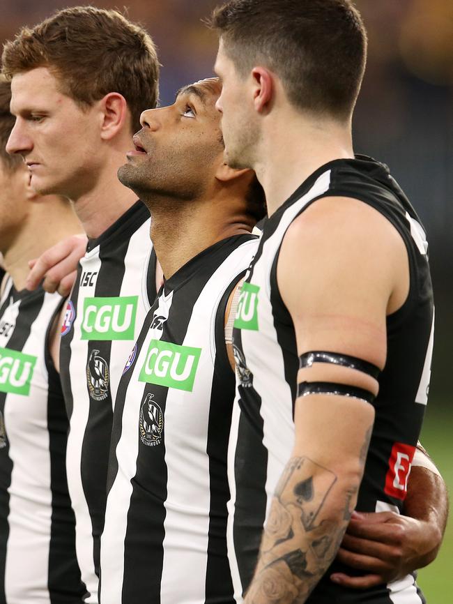 Collingwood's Travis Varcoe looks to the heavens after a minutes silence in remembrance of his sister Maggie before the qualifying final. Picture: Michael Klein