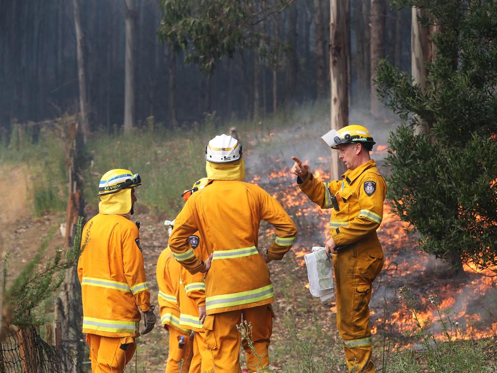 January 2019 Tasmanian Bushfires. TFS firefighters put in a controlled fire break behind a home on Donnellys Rd, Geeveston, in the Huon Valley. Picture: NIKKI DAVIS-JONES