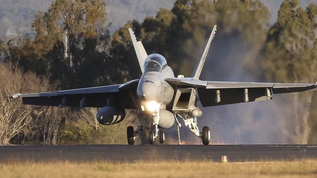 A Royal Australian Air Force F/A-18F Super Hornet aircraft lands while engaging the aircraft arrestor cable at RAAF Base Amberley, Queensland. *** Local Caption *** Air Forceâs aircraft arrestor systems are lifesaving devices utilised in fast jets to preserve the life of the pilot and aircraft in the event of an emergency. Once a fast jetâs hook engages the cable, the arrestor systemâs brakes rapidly decelerate the fast jet as it travels along the runway. Serviced every morning by Combat Support Groupâs Mechanical Equipment Operations and Maintenance Sections at RAAF Bases Amberley, Williamtown, Richmond, Edinburgh, Pearce, Darwin and Townsville, the systems are always ready to go whenever Air Forceâs fast jets are in the air.