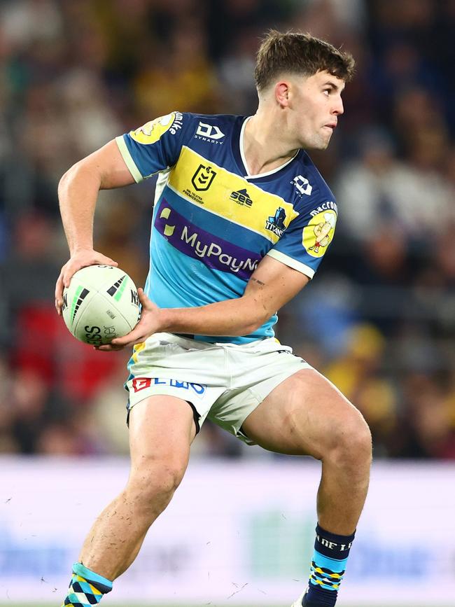 Toby Sexton of the Titans passes during the round 18 NRL match between the Gold Coast Titans and the Brisbane Broncos at Cbus Super Stadium, on July 16, 2022, in Gold Coast, Australia. (Photo by Chris Hyde/Getty Images)