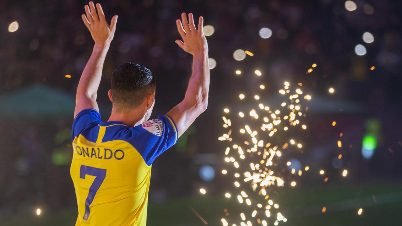 Ronaldo poses with Al Nassr shirt after signing for Saudi club