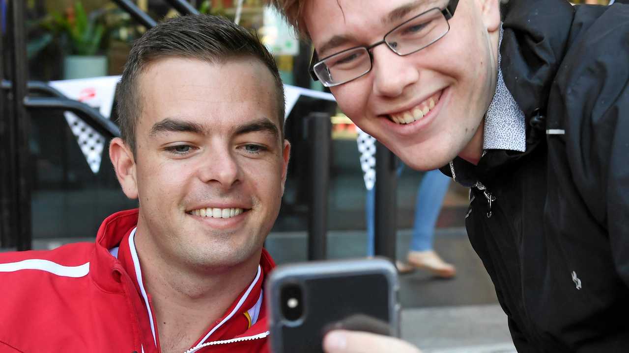 Chris Nicholls gets a photo with Scott McLaughlin at the Supercars fan day at Orion on Saturday. Picture: Rob Williams