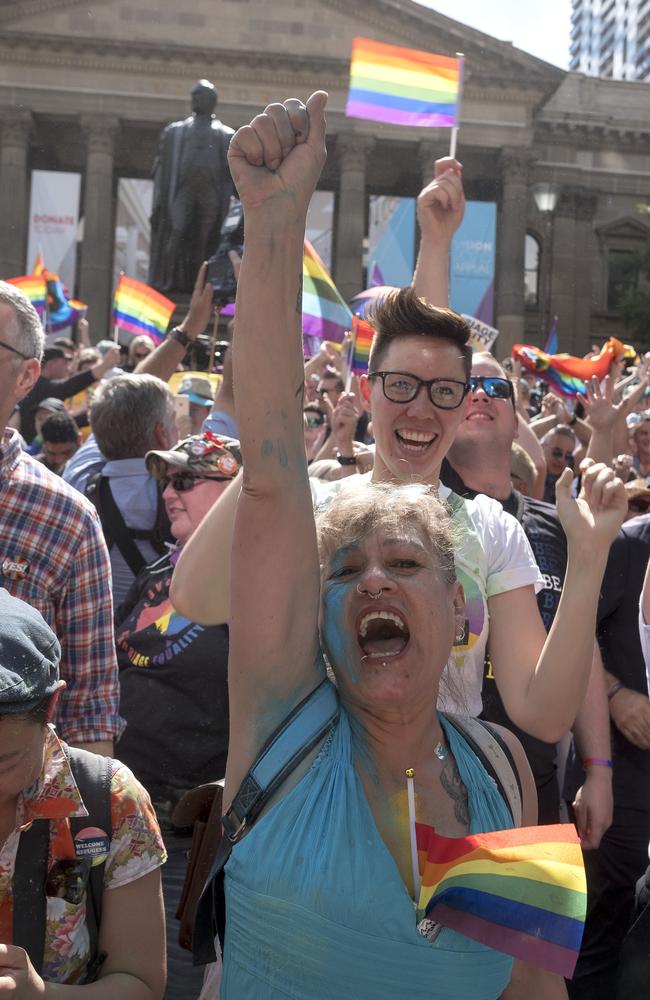 The crowd react to the same-sex marriage postal survey Yes result in front of the State library of Victoria in Melbourne, Wednesday, November 15, 2017. Picture: AAP Image/Luis Enrique Ascui