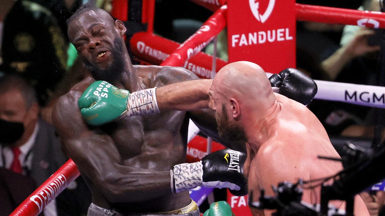 Tyson Fury (R) lands a bomb on Deontay Wilder in the eighth round. Picture: Ethan Miller/Getty