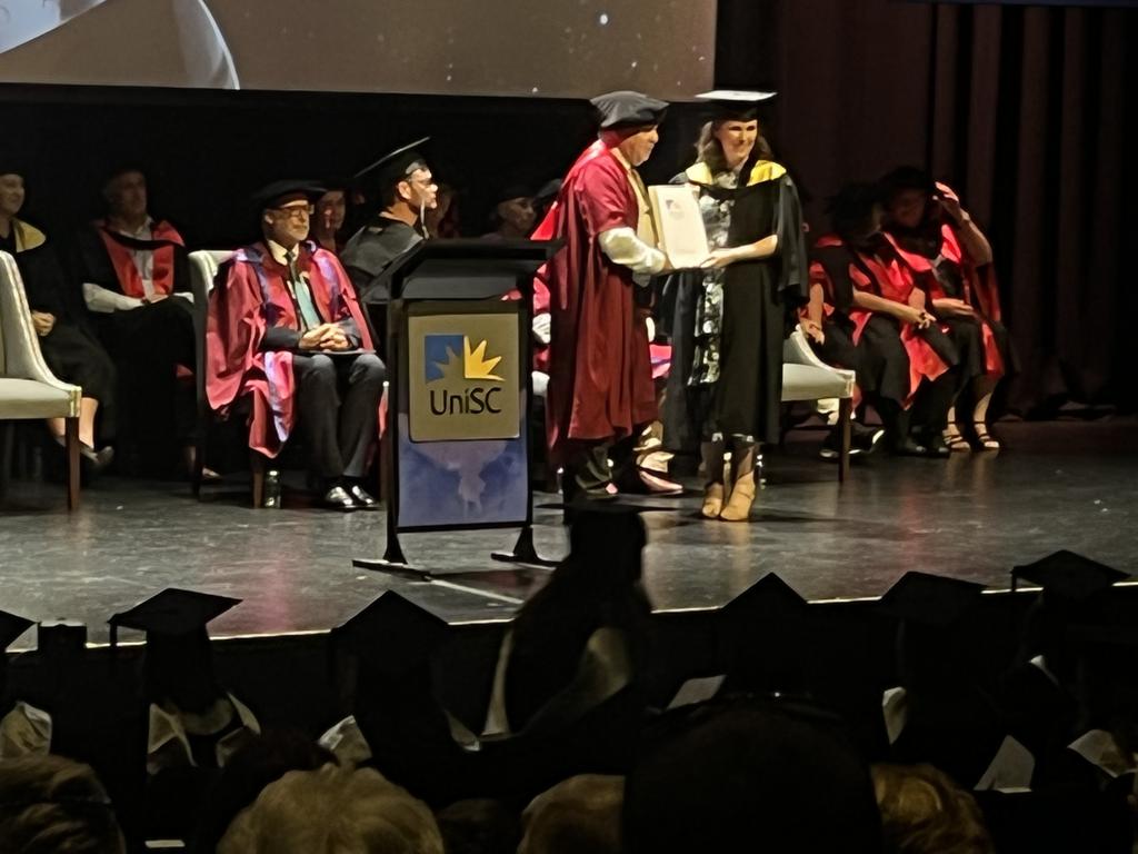 Graduates from the University of the Sunshine Coast's Fraser Coast campus celebrating at the Brolga Theatre.