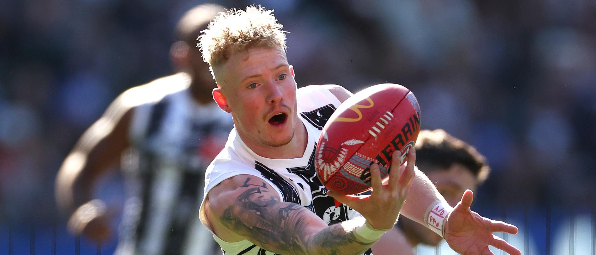 MELBOURNE, AUSTRALIA - MAY 18: John Noble of the Magpies marks during the round 10 AFL match between Collingwood Magpies and Kuwarna (the Adelaide Crows) at Melbourne Cricket Ground, on May 18, 2024, in Melbourne, Australia. (Photo by Quinn Rooney/Getty Images)