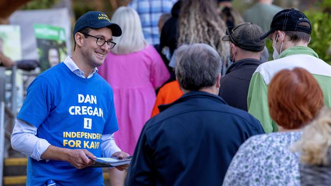 Former Liberal member and now independent candidate in the seat of Kavel Dan Cregan handing out how to vote cards at Littlehampton Primary School. Picture: Naomi Jellicoe