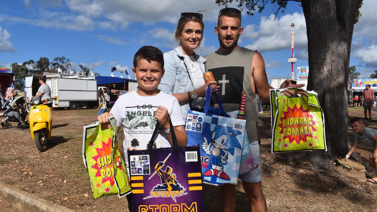 Emma, Ty and Mason White show of their show bag haul from the Fraser Coast Ag Show for 2021. Photo: Stuart Fast