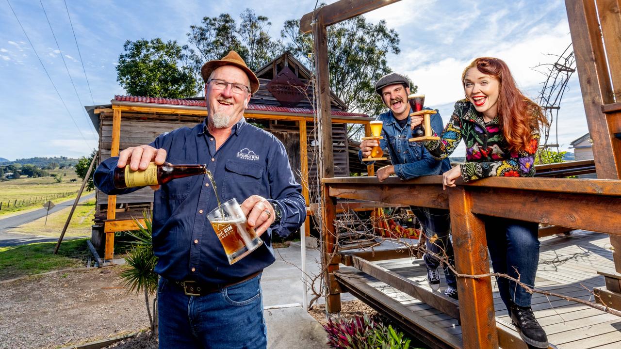 Scenic Rim Brewery head brewer Mike Webster (left) with locals Matt Whaley and Kate Creasey enjoying a beer for Eat Local Week in the Scenic Rim.