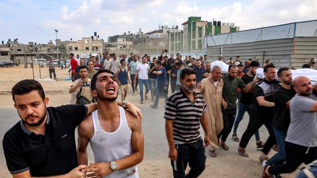 Emotions run high at the funeral for a Palestinian family killed in an Israeli airstrike on Khan Yunis. Picture: AFP