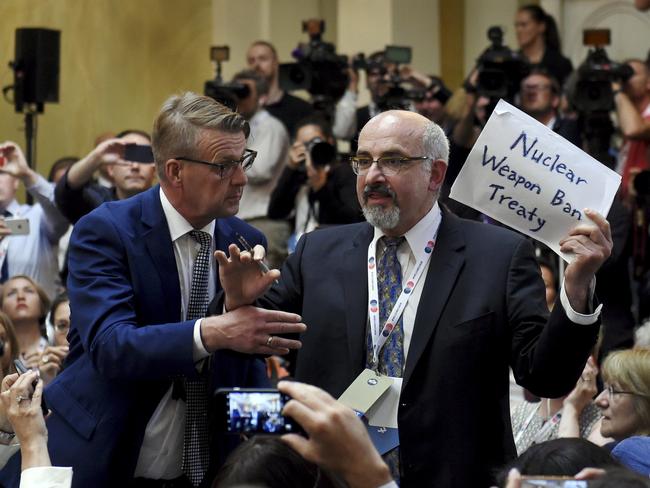 The protester claimed to be a journalist from The Nation before he was dragged out of the room. Picture: Antti Aimo-Koivisto/Lehtikuva via AP