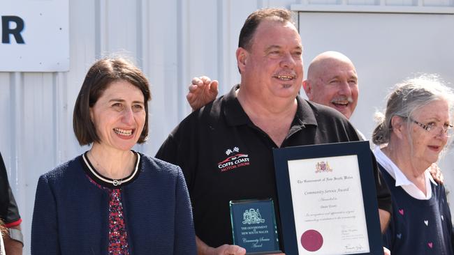 Dean Evers with the NSW Premier Gladys Berejiklian after being presented a community service award on October 26, 2020.