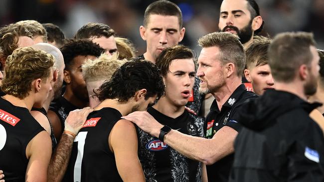 Nathan Buckley talking to his players during the Anzac Day defeat. Picture: Getty Images