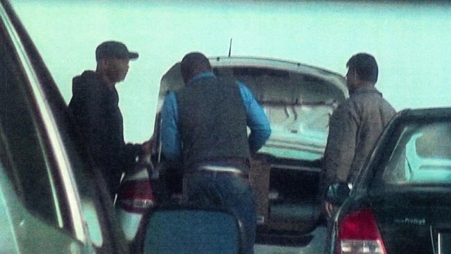 Police surveillance images of Prince Ibeh (centre) with two other men in June. Picture: AFP 