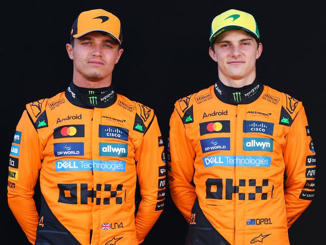 MELBOURNE, AUSTRALIA - MARCH 13: Lando Norris of Great Britain and McLaren and Oscar Piastri of Australia and McLaren looks on during previews ahead of the F1 Grand Prix of Australia at Albert Park Grand Prix Circuit on March 13, 2025 in Melbourne, Australia. (Photo by Clive Rose/Getty Images)