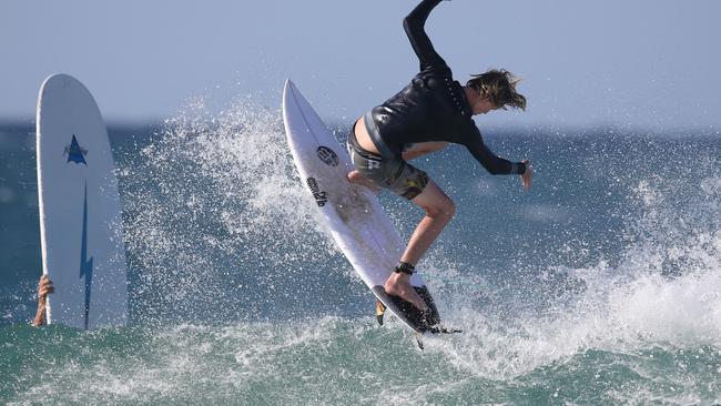 A young surfer takes to the air at the Superbank yesterday. Picture: Regi Varghese