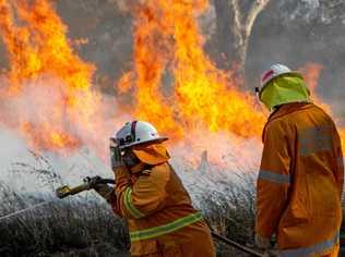 The Queensland Rural Fire Service in action. Picture: Dominic Elsome