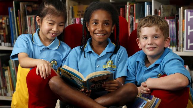 Yorkeys Knob State School students Miya Tsay, 8, Emmanuella Kiwa, 9, and Caylan Edwards, 8. The school was 