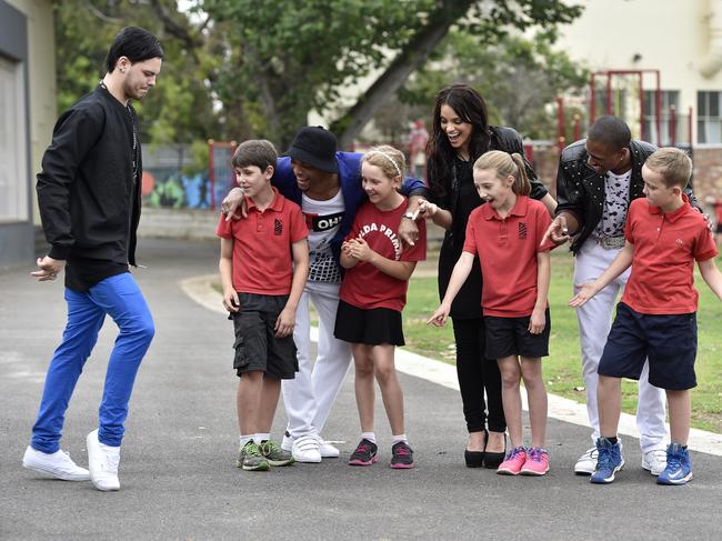 Alex Buchanan, from the cast of Thriller, performs the moonwalk for St Kilda Primary School students Oscar, Wayne Robinson, Emily, Melinda Tzambazakis, Maggie, J Rome and Eden watch on. Emily Picture: Andrew Batsch