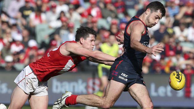 North's Samuel McInerney tries to stop Norwood's William Abbott. Picture: Sarah Reed