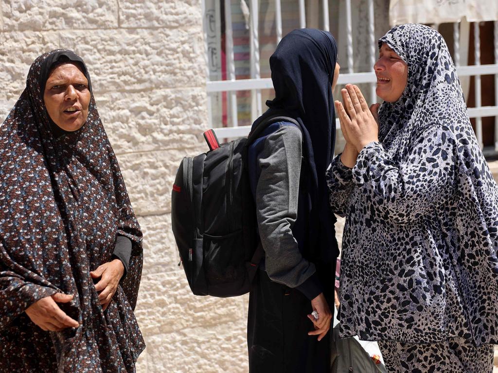 Palestinian as they flee the area of the Latin Patriarchate Holy Family School following a warning by the Israeli military to evacuate during the Israeli military bombardment of Gaza City. Picture: Omar Al-Qattaa/AFP