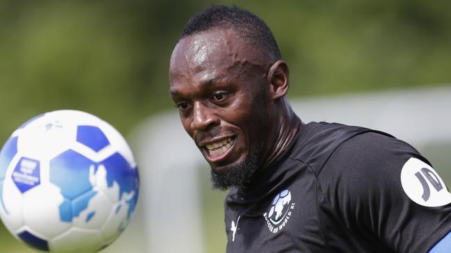 Usain Bolt is serious about trying to crack it as a footballer.