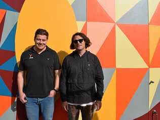 TARGO STREET ART: Orange Moose Dentistry owner Hanno Venter and artist Kyle Hughes-Odgers, enjoying the special and "almost finished" wall mural, ahead of the practice opening later this month. Picture: Rhylea Millar