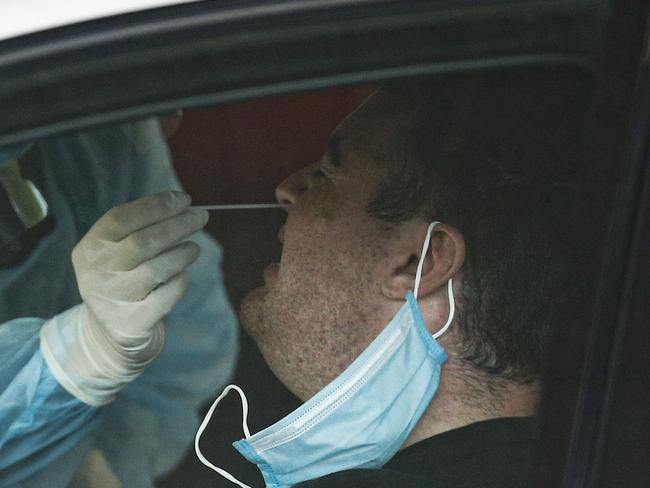 MELBOURNE, AUSTRALIA - NCA NewsWire Photos October 23, 2020:   A person is tested for COVID-19 at a pop-up test site at Broadmeadows Central in Broadmeadows, Melbourne, Victoria. Picture: NCA NewsWire / Daniel Pockett