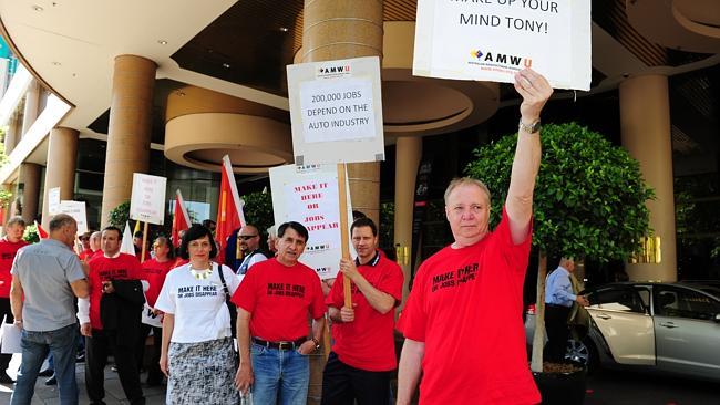 Workers protest outside the Productivity Commission hearing in Melbourne. Picture: Mark Brake