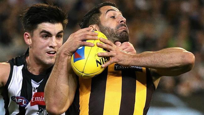 Hawthorn coach Alastair Clarkson has spoken to Hawk Paul Puopolo about ducking. Picture: Wayne Ludbey