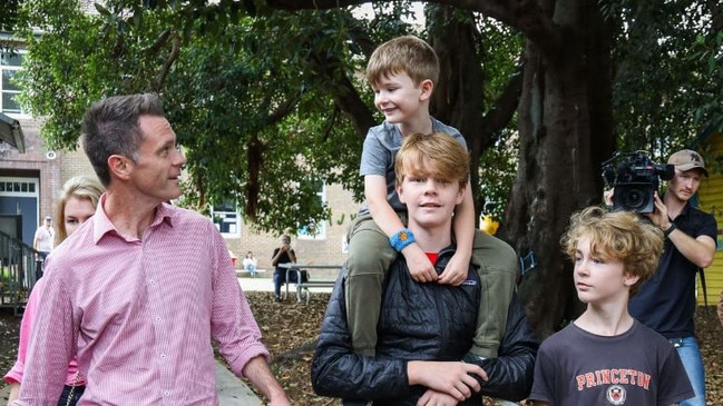 Chris Minns with his three sons – Joe, Nick and George – at the polling booths. Picture: Instagram