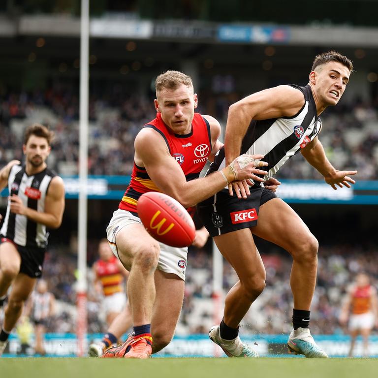 Rory Laird of the Crows and Nick Daicos of the Magpies compete for the ball. Picture: Getty Images