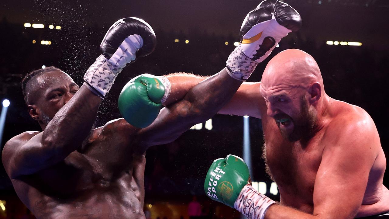 Tyson Fury lands on Deontay Wilder. Photo by Al Bello/Getty Images.