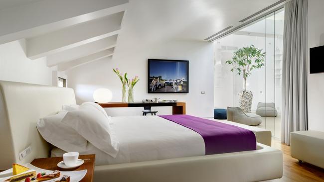 The room As a self-confessed design lover (especially when it comes to Italian mid-century), my ‘Collection Room’ gets the tick of approval. It’s light and bright, with blonde hardwood flooring and a sophisticated palette of brown, white and grey, with contemporary art adding pops of colour. Particularly special is the leather bed-frame which wraps around the bedding like a cocoon, and the curved wooden wardrobe which bisects the bedroom and bathroom (also housing a well-stocked mini bar). The bathroom is spacious, with lovely stone finishes and an enormous waterfall shower. For a little more wow factor, the Skylight Suite offers beautiful views of Rome, plus a gorgeous sun-washed winter garden, perfect for an afternoon campari spritz.