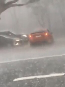 Cars trapped in the hail at Ingleburn.