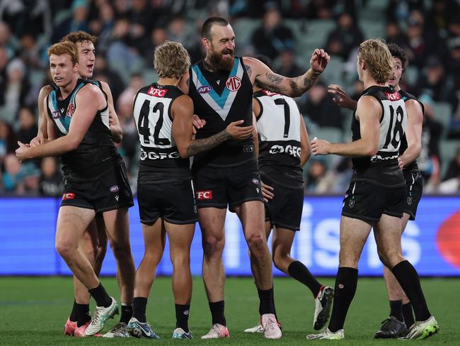 Charlie Dixon and the Power celebrate last week’s win over Richmond. Picture: James Elsby/AFL Photos