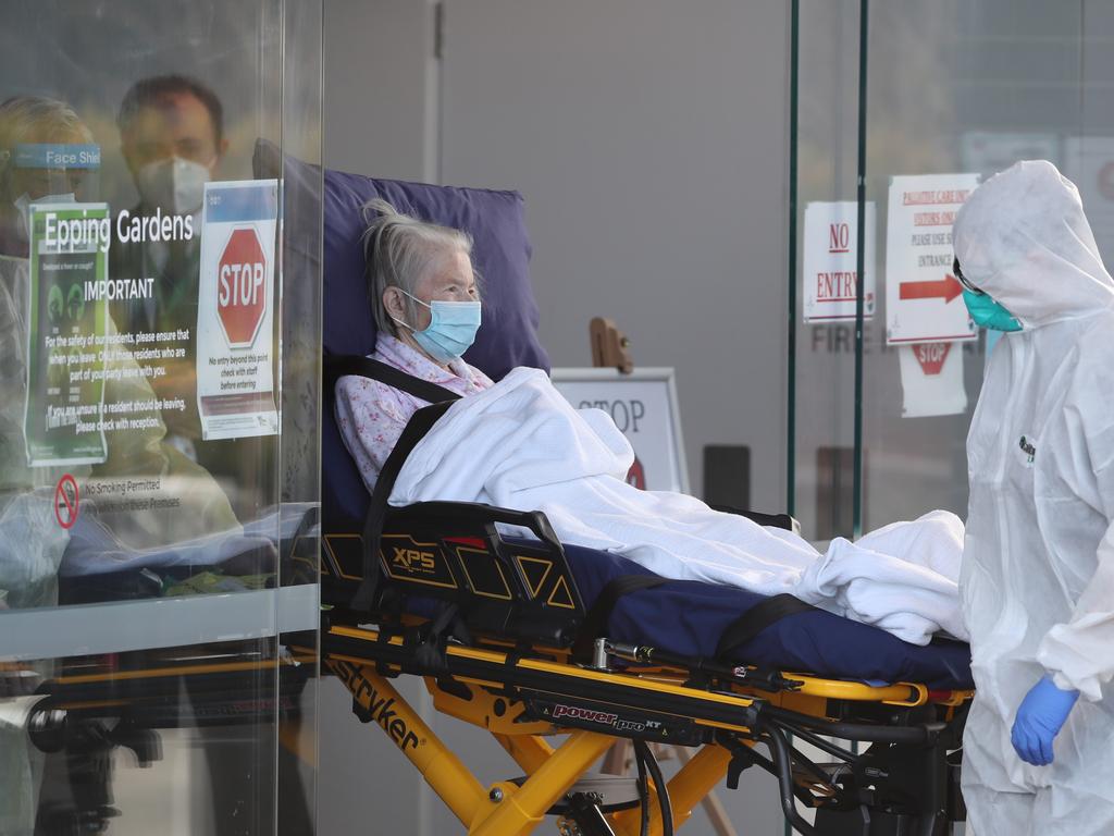 A resident is taken out of Epping Gardens Aged Care where almost 90 people have become infected. Picture: David Crosling/NCA NewsWire