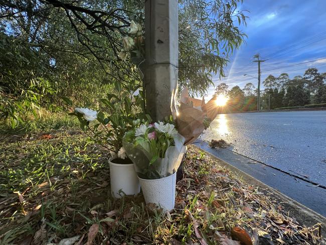 Flowers at the Helensvale Rd scene where Tony Charlwood and Krystal Evans died on Saturday morning. Picture: Keith Woods.