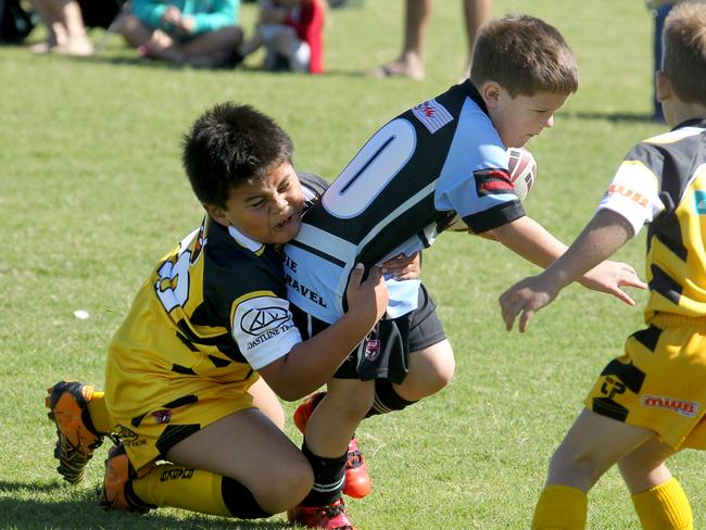 Junior rugby league, Bribie Island. Warrigals v Caloundra JRLFC. Under 7, Jackson Bates caught in a tackle