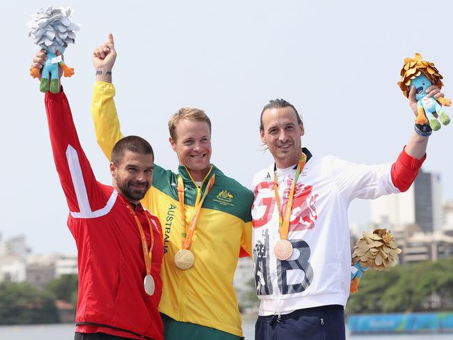 (L-R) Markus Swoboda of Austria, Curtis McGrath of Australia and Nick Beighton of Great Britain pose on the medals podium after the men's KL2 final at Lagoa Stadium.