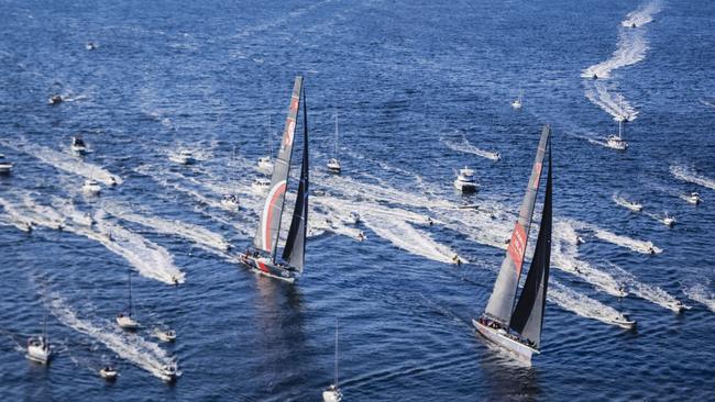 The start of the race is watched by thousands from land and sea.